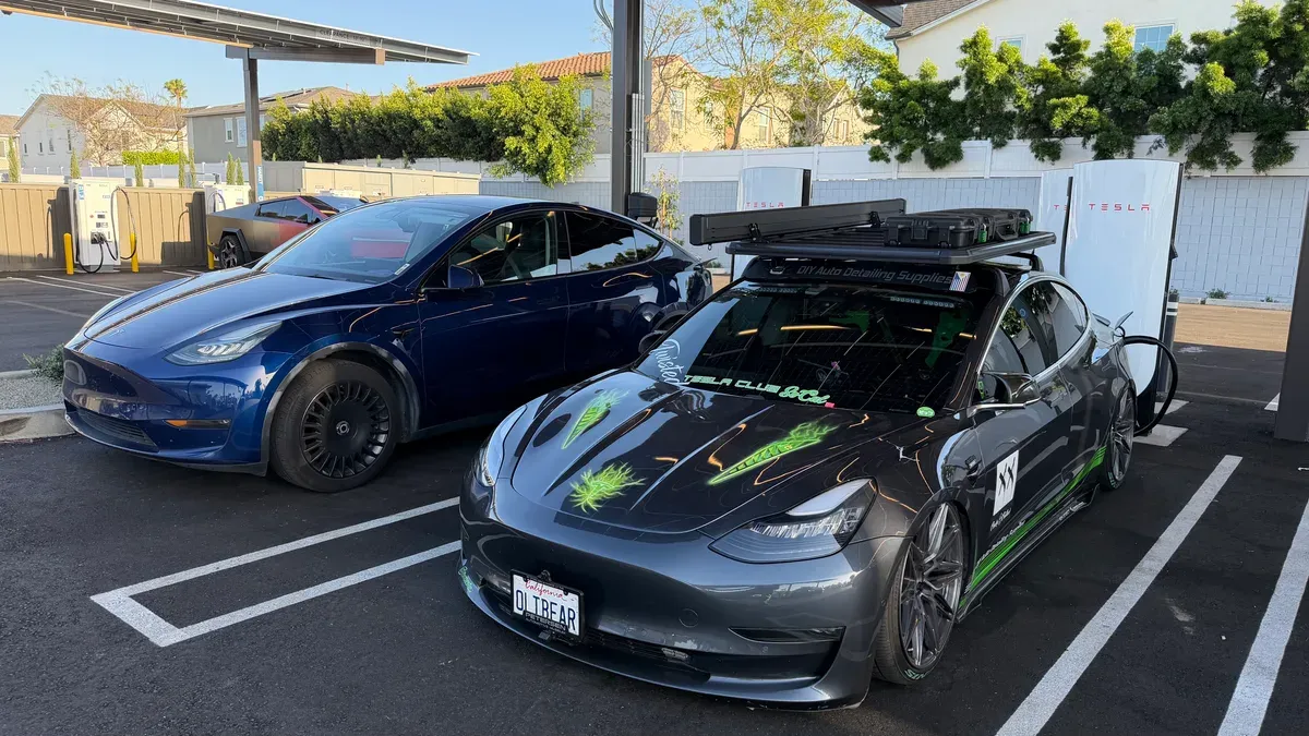 Tesla Model Y and customized Tesla Model 3 at a Supercharger station at Rove Costa Mesa.