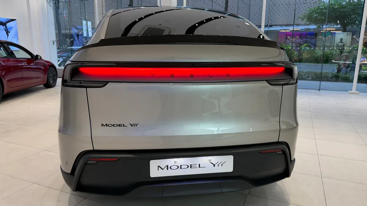 Rear straight view of the Model YL showing the full-width taillight bar