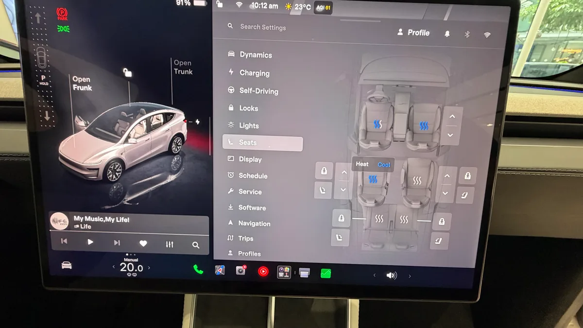 Tesla Model YL touchscreen showing the Seats menu with heating and cooling controls.