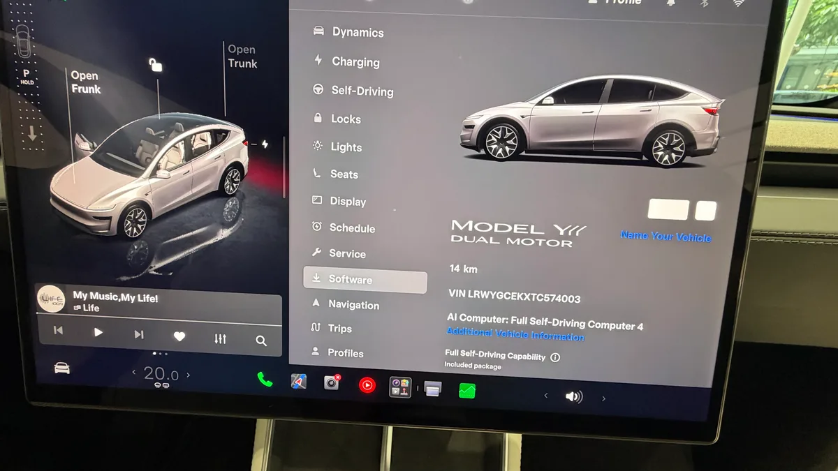 Tesla Model YL touchscreen showing the Software menu, Dual Motor badge, and Full Self-Driving Capability included package.