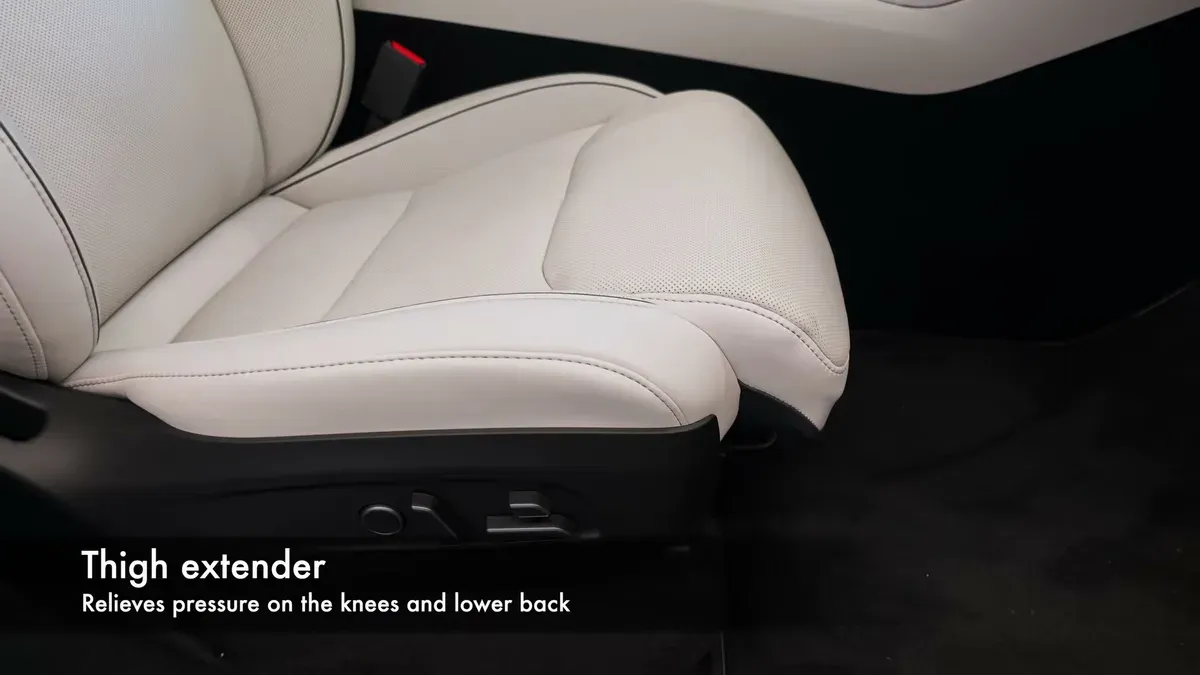 Tesla touchscreen showing the thigh extender deployed, labelled as relieving pressure on the knees and lower back.