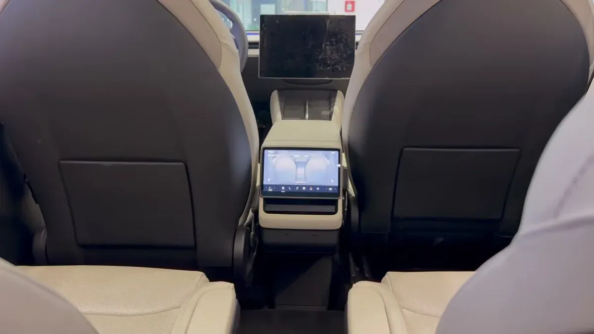 Third-row view showing the elevated seating position and recliner controls