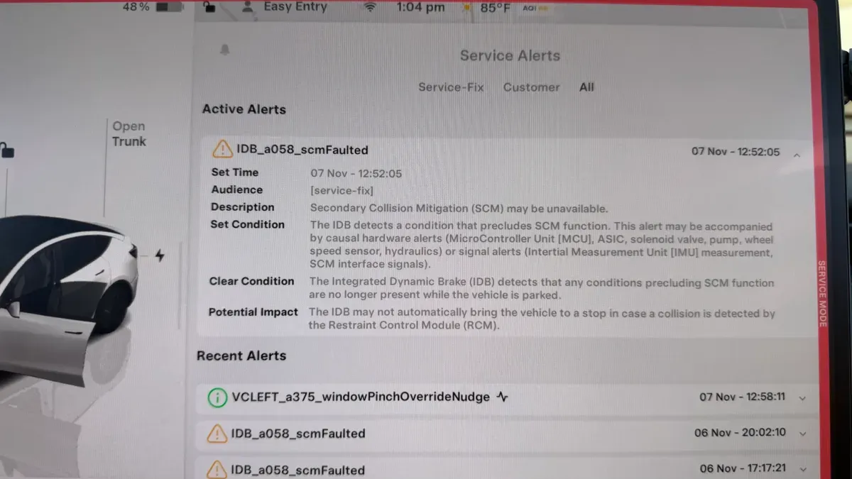 Tesla service alerts screen showing IDB SCM faulted and window pinch override errors