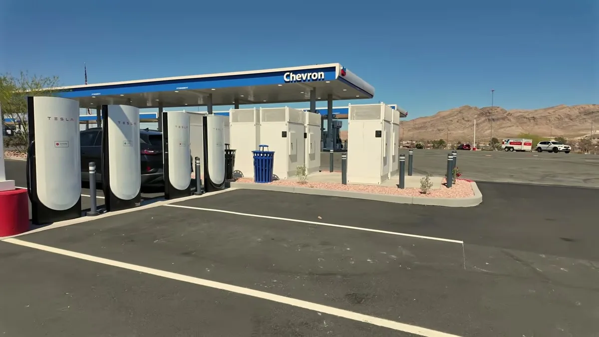 Tesla Supercharger next to Chevron gas station