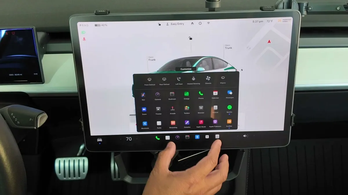 Tesla Model Y touchscreen showing the full app menu with Arcade option visible