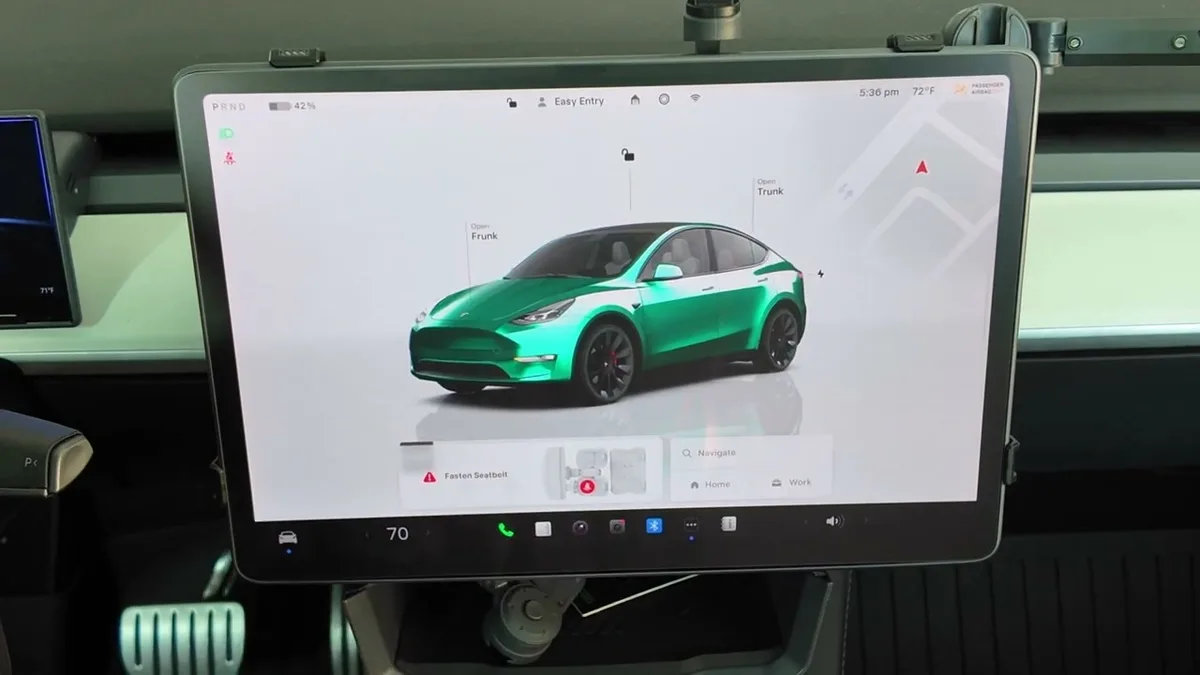 Tesla Model Y Performance touchscreen showing the green Model Y home screen